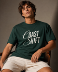 Men’s forest green 240 GSM cotton regular fit graphic T-shirt with Coast Shift front typography by ZVYRO
