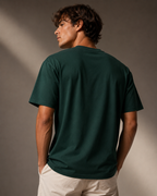 Men’s forest green 240 GSM cotton regular fit graphic T-shirt with Coast Shift front typography by ZVYRO