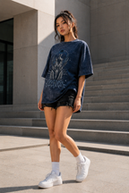 Distressed grey black and blue celestial graphic on navy acid-wash oversized T-shirt