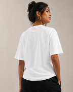 Women wearing a white 240 GSM regular fit cotton T-shirt with crew neck and short sleeves