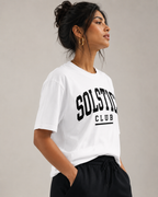 Women wearing a white 240 GSM regular fit cotton T-shirt with crew neck and short sleeves